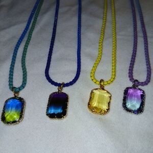 Green ,blue,yellow,and purple crystal on multi colored chain all 4 for